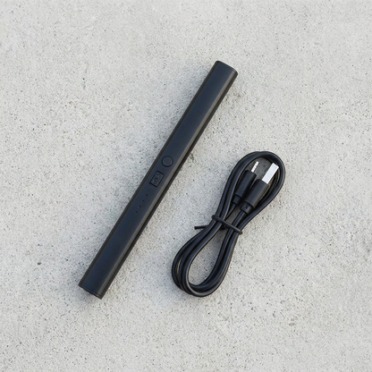 Apex Arc Lighter with included USB charging cable, flat lay